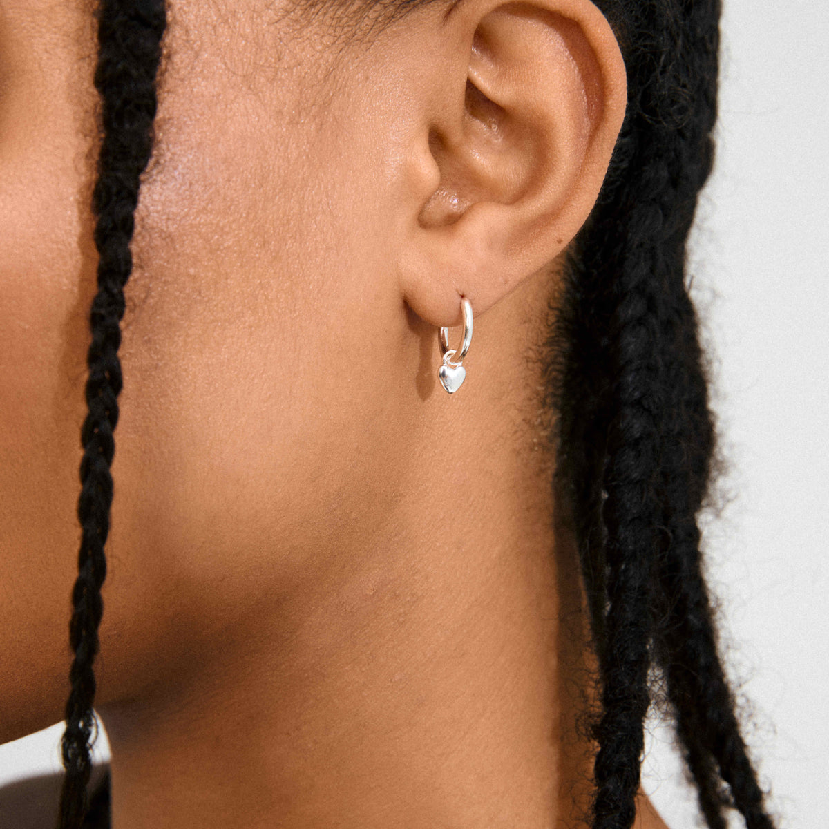 ALAIA recycled tiny heart pendant earrings