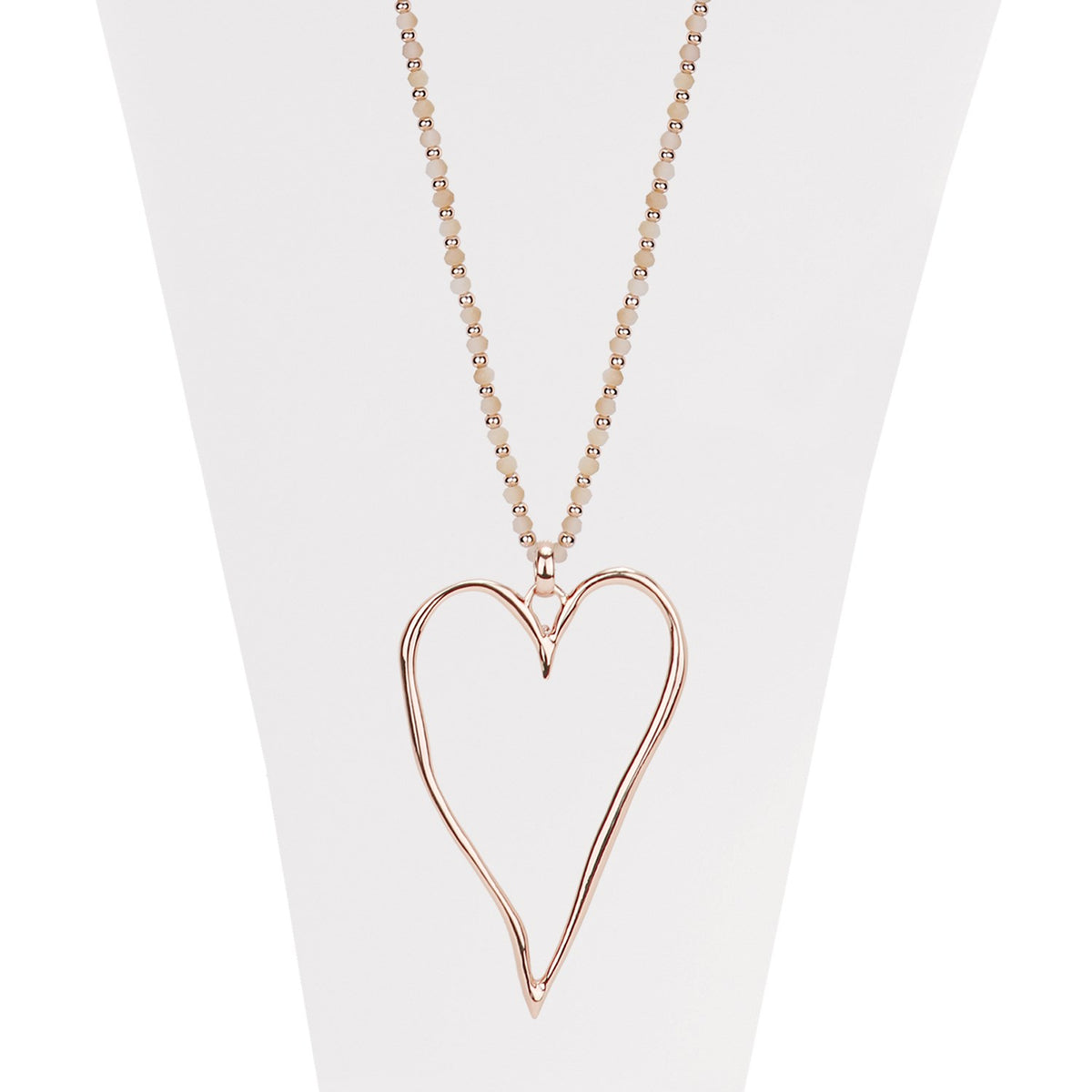 Nude and rose gold necklace with faceted beads and large wavy heart pendant 