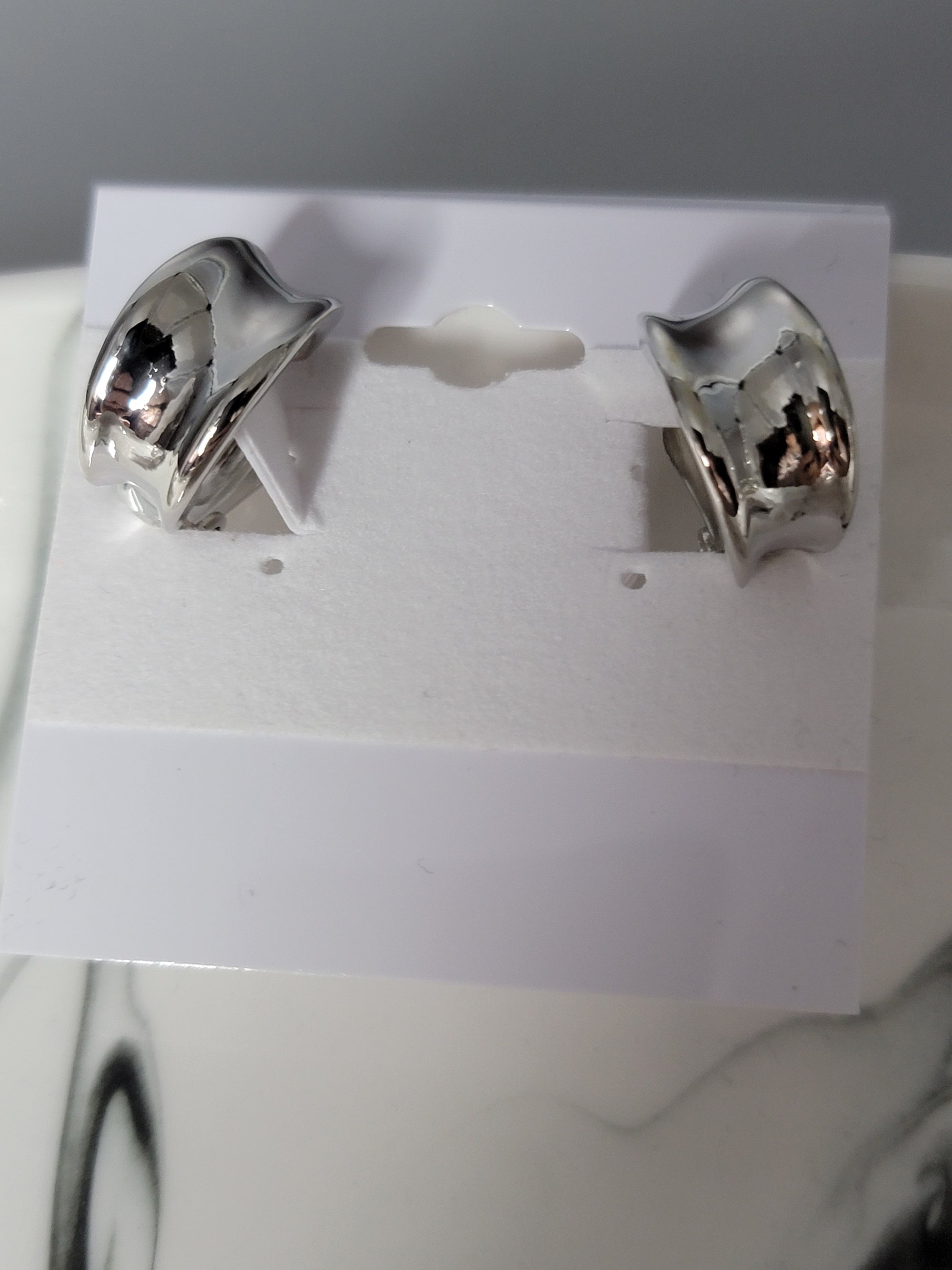 shiny silver clip fashion earrings