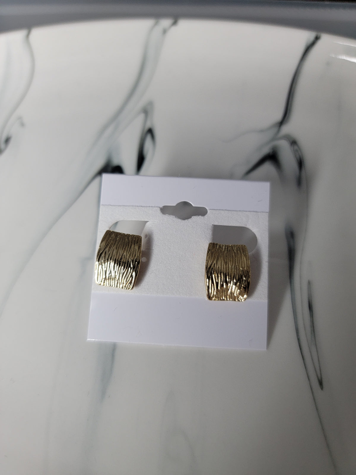 gold patterned clip on earrings