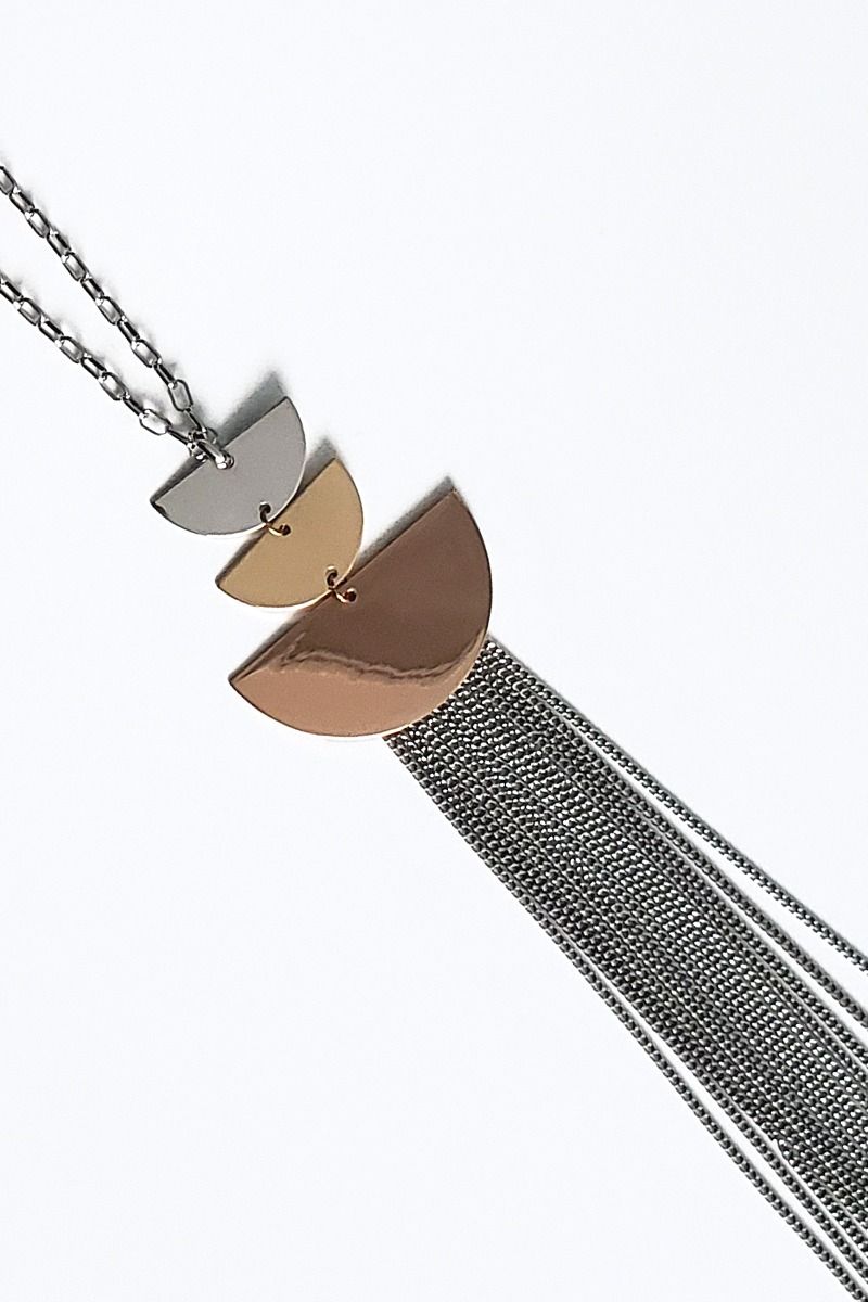 long  fashion jewellery necklace features silver tone pendants and luxe tassel. 13" 7.5"decor drop 4.5 " extension with lobster clasp closure