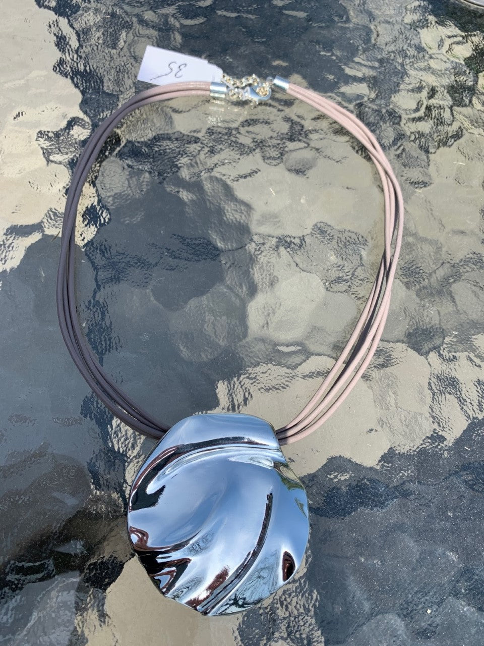 Merx fashion jewellery necklace shiny silver medallion on taupe cord   matching bracelet available