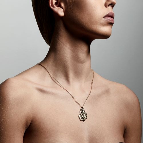 model wearing pilgrim jewellery compassion gold necklace