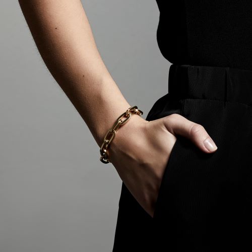 model showing gold  tolerance bracelet by pilgrim jewellery on her wrist